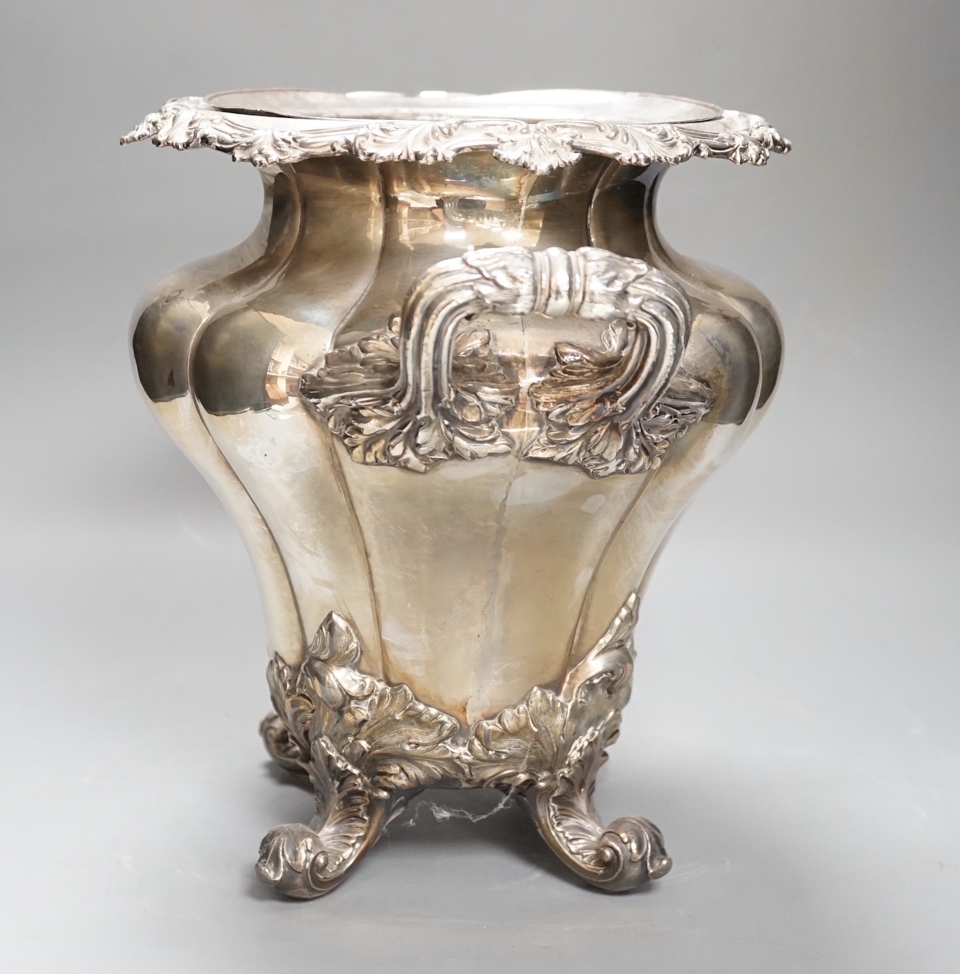 A William IV Old Sheffield plate twin handled wine cooler, with liner, acanthus scrolled borders, on four scrolled feet Height 28cm